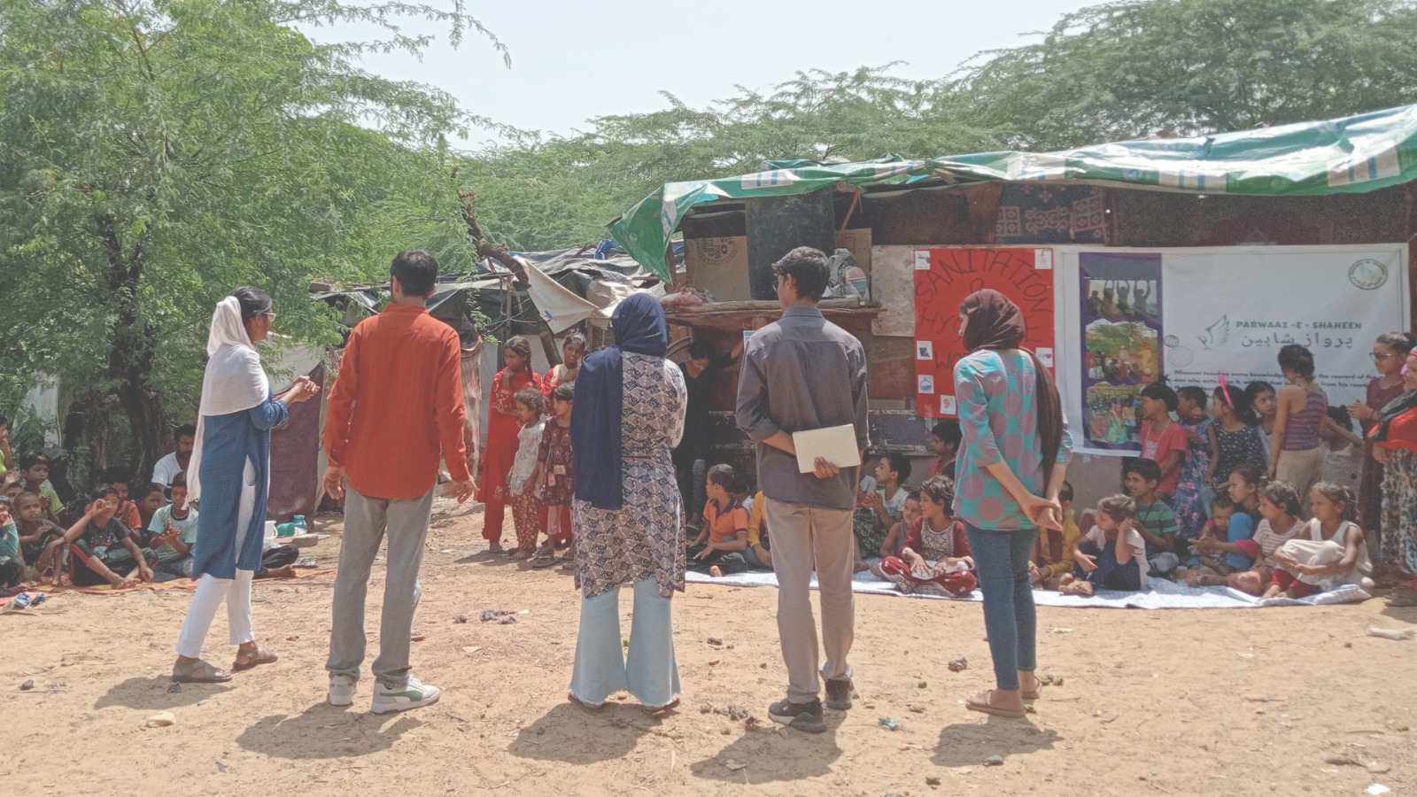 Volunteers leading a community session at Parwaaz-e-Shaheen